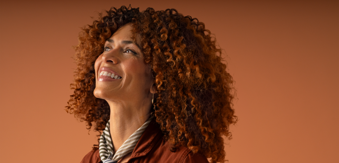 A woman smiles confidently