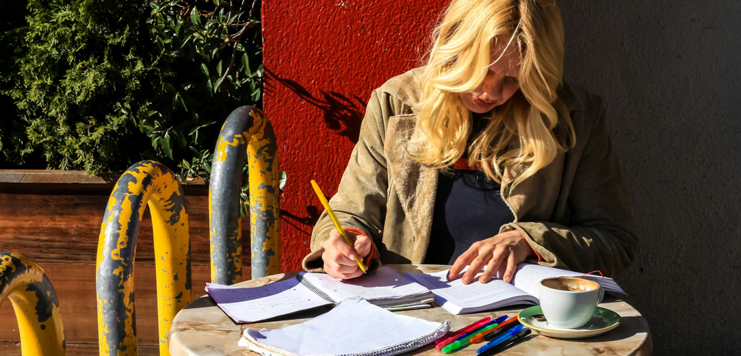A woman studying outside