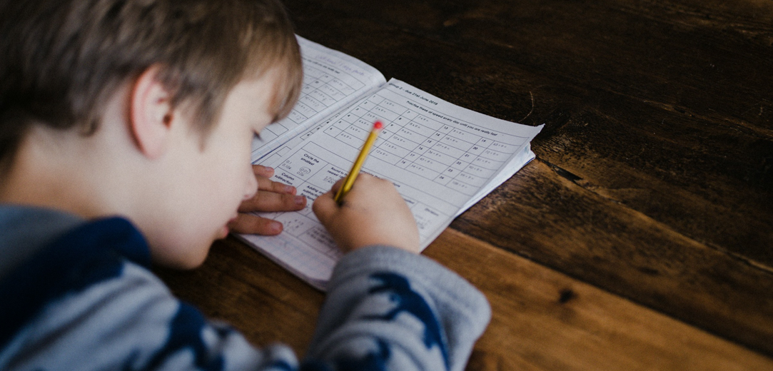 A young boy working on a quiz