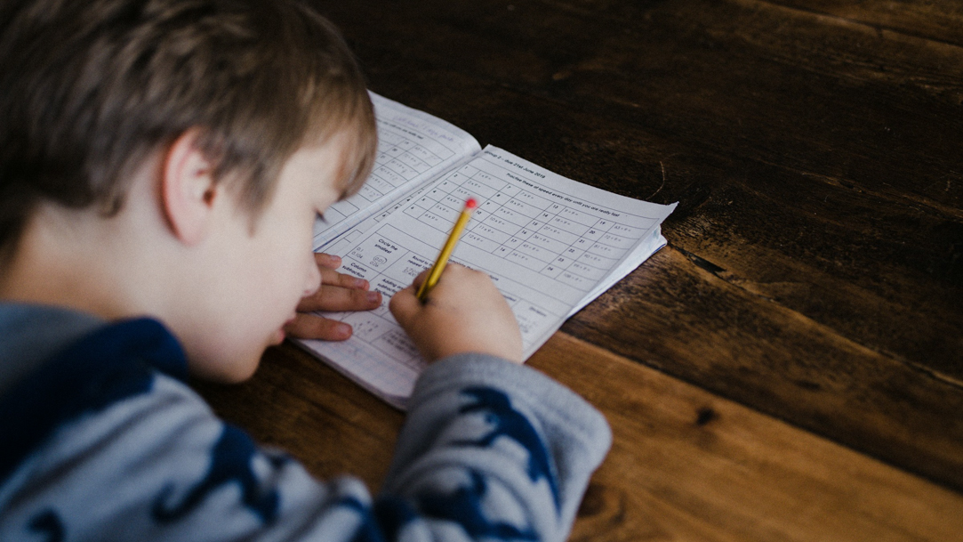 A young boy working on a quiz