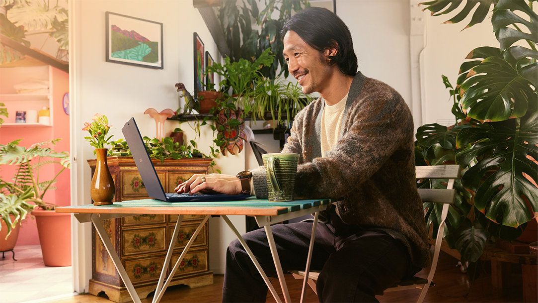 An artist in a coffeeshop learning how to install fonts on Windows