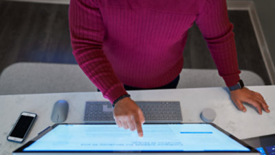 Be Your Family 39 s DJ with Surface - MSFT An Image Looking Down At A Surface Studio 2 Workspace With A Surface Dial On The Desk