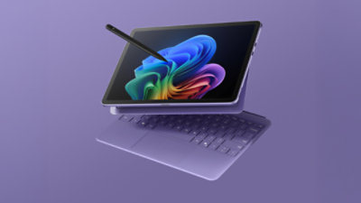 An image of a Surface Pro 2-in-1 with keyboard in violet color closeup with Copilot+ PC Bloom on screen and a Surface Slim Pen