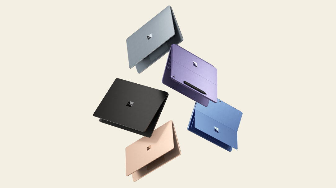 An image of three lightweight Surface Laptops and two lightweight Surface Pro 2-in-1 PCs floating in the air