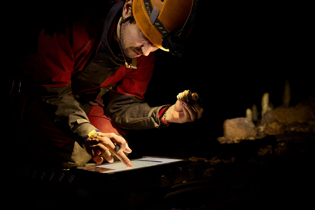 Archaeologist uses Surface Pro software to examine a specimen