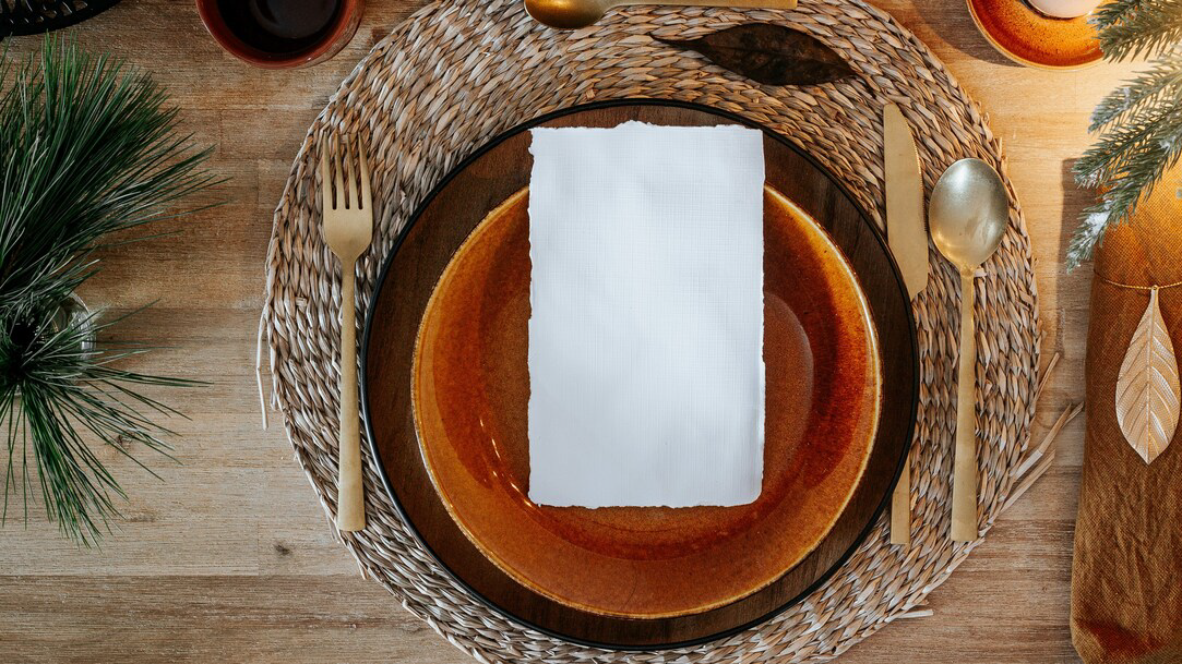 Brown and white paper on brown woven round basket photo