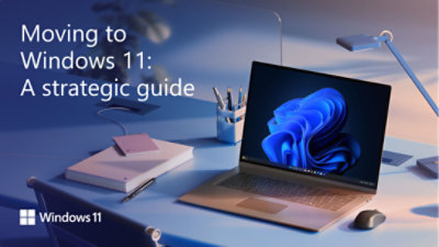 An extreme closeup of an open Windows 11 Pro PC laptop, partially showing the keyboard on the upper left and blue bloom image on the upper right, dramatically viewed from the side against a gradient blue-black background