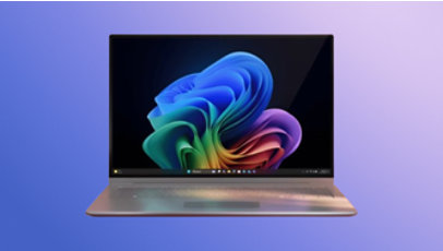 A chrome Copilot+ PC laptop displaying the rainbow bloom image