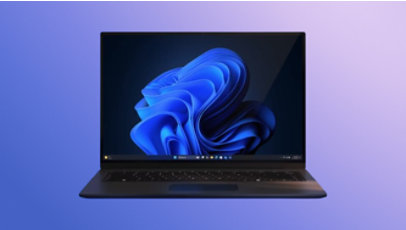 An open Windows 11 laptop displaying a blue bloom image