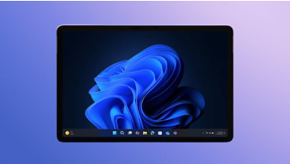 A Windows 11 2-in-1 device displaying a blue bloom image