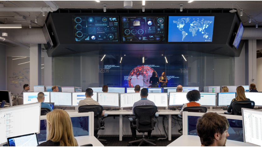 Room of IT professionals working on computers 