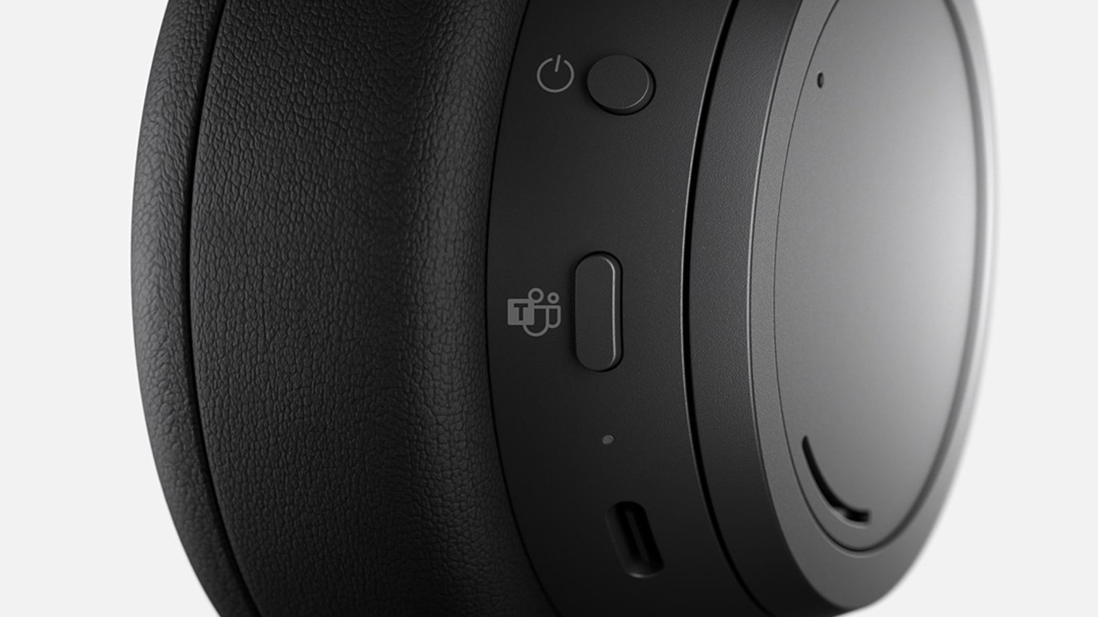 Close-up view of the Teams Button on the ear cup on Surface Headphones 2+