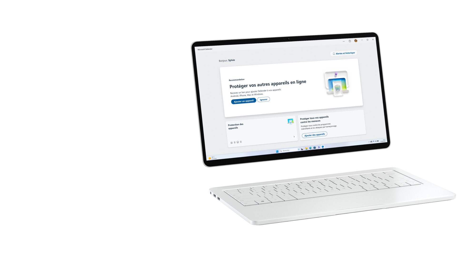 Écran d’ordinateur montrant la fenêtre Microsoft Defender, un clavier posé à côté
