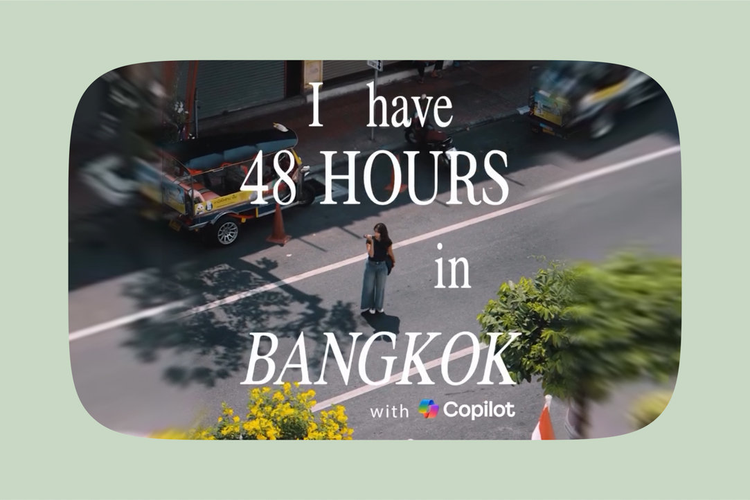 A woman walking down a street with “I have 48 hours in Bangkok with Copilot” on top