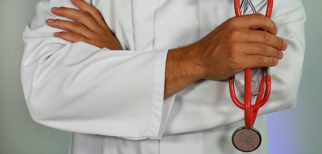 Doctor holding a red stethoscope