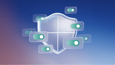 A translucent, glossy shield centred on a gradient blue background, surrounded by multiple toggle switches in the green 'on' position, suggesting enabled security settings. 