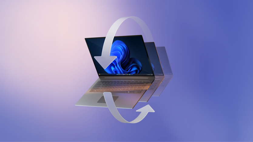 A laptop with a blue bloom on its screen, shown in motion with a transparent duplicate behind it with two large semi-transparent arrows form a circular shape around the laptop.