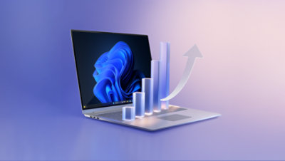 화면에 파란색 꽃 모양이 표시되어 있고 막대 그래프가 나오는 노트북.