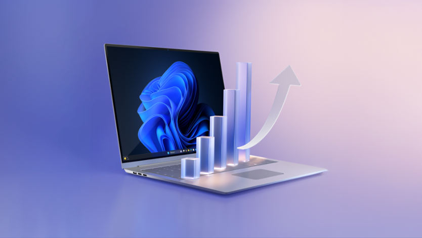 A laptop with a blue bloom on its screen with bar graph coming out of it.