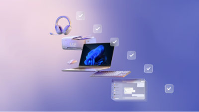 화면에 파란색 꽃 모양이 표시된 노트북과 주변에 떠 있는 액세서리.