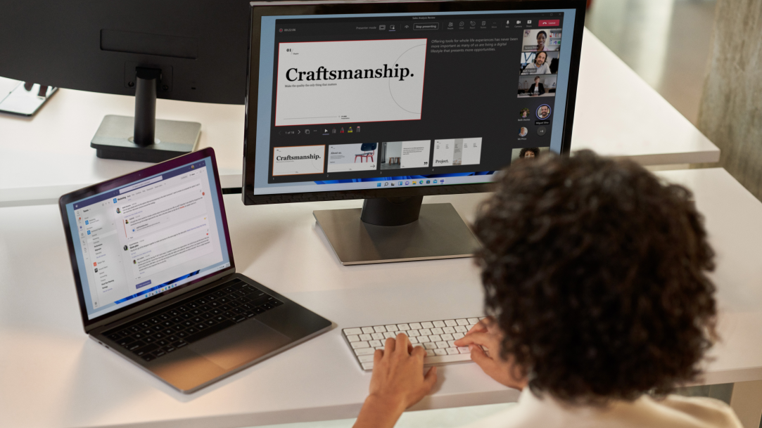 A Designer collaborating with her team as she makes changes using the Snipping Tool to reconstruct a layout per their discussion.