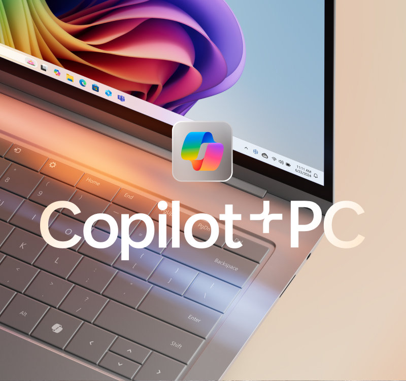 Bærbar PC med Copilot-logo og fargerik blomstring