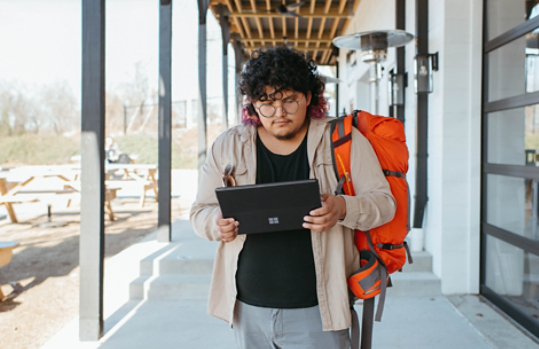 Man walking with Surface tablet