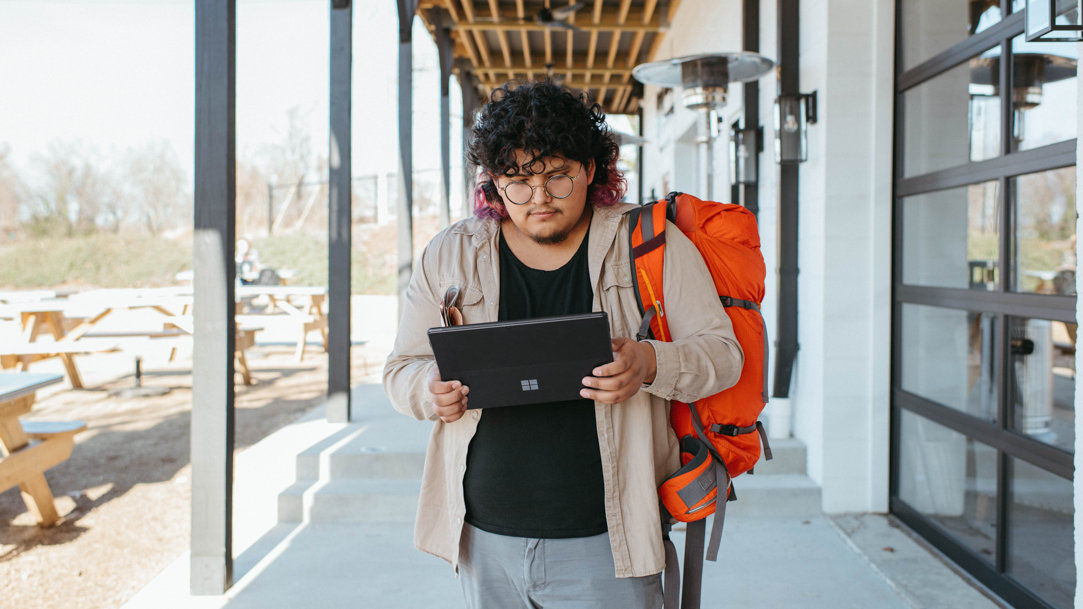 Man walking with Surface tablet