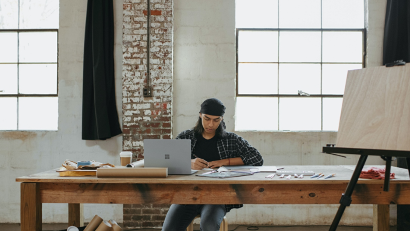 Man working in studio with Surface laptop