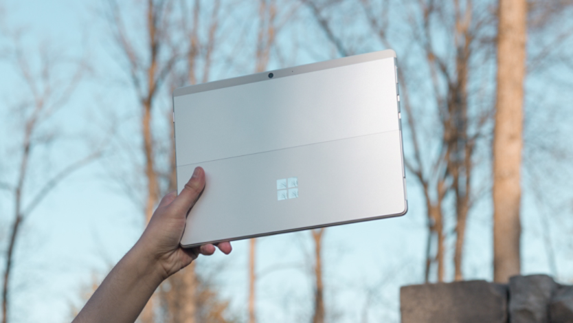 Person holding a Surface device outside