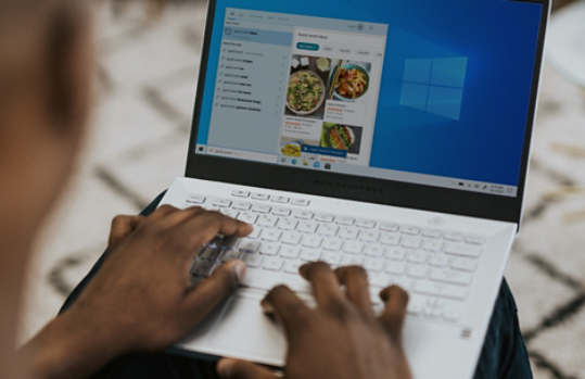 Person looking at recipes on a Windows 11 laptop