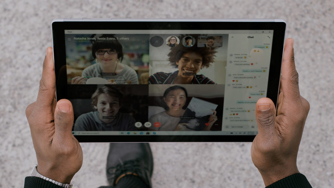 Person on video call with Surface device