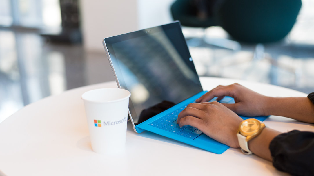 Person typing on a Surface 2-in-1 PC