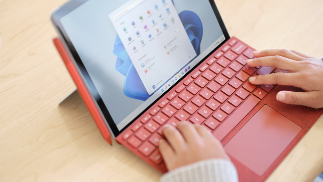 Person typing on a Surface detachable keyboard