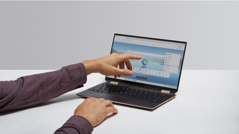 Person using Microsoft Edge on a laptop