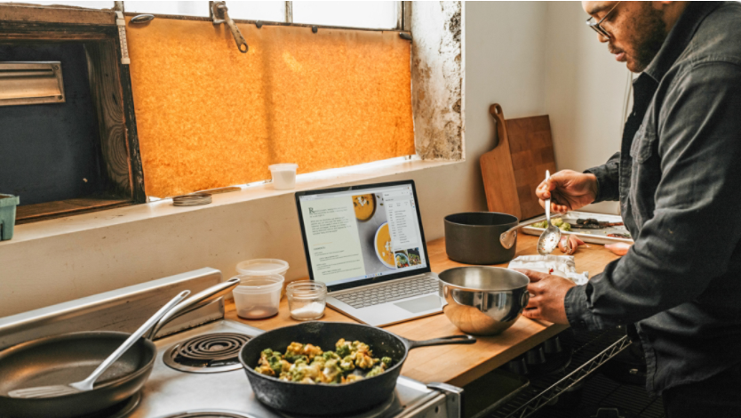 Person using Microsoft Edge tools while cooking