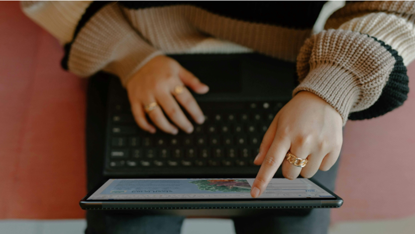 Person using a touchscreen laptop