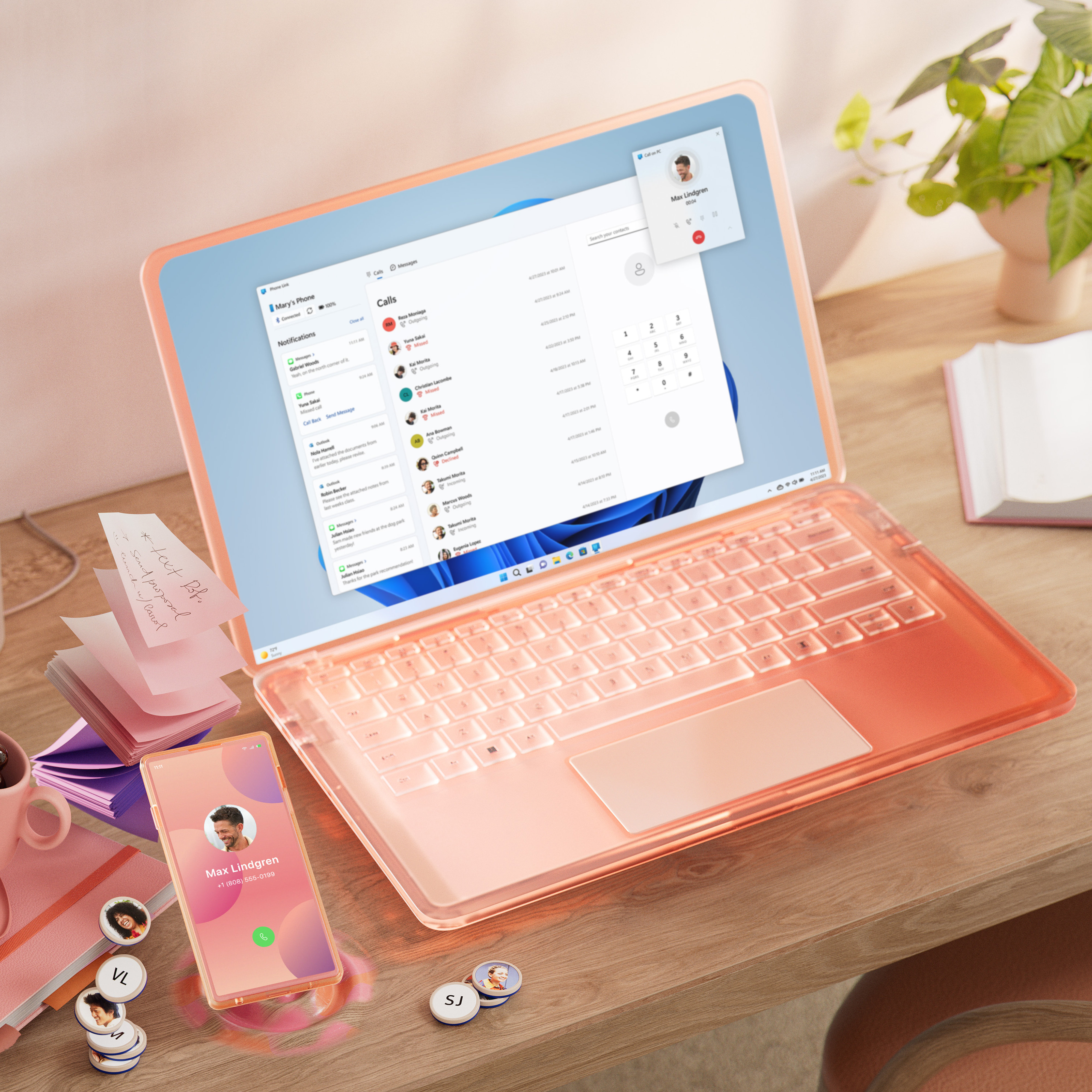 Una colorida PC y dispositivo móvil sobre un escritorio, con una taza de café y bolígrafo