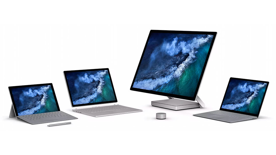 Several Surface devices with a Surface Dial sitting in front