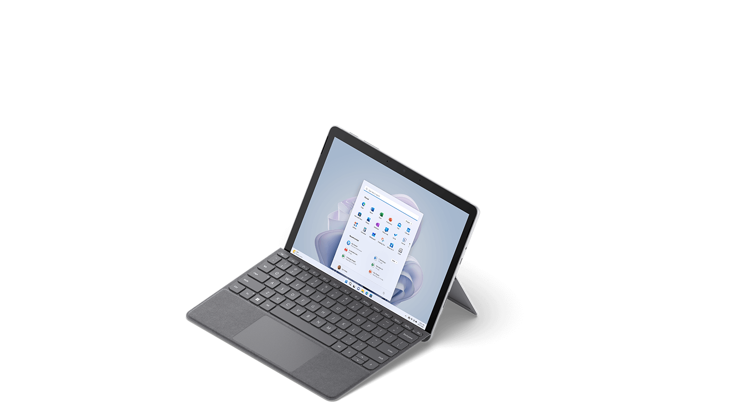 A 3/4 view from slightly above of Surface Go 3 in Platinum with a Surface Type Cover attached.