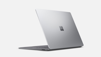 Surface Laptop 5 in platinum shown from behind with the lid slightly closed.