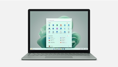 Surface Laptop 5 shown from the front in sage with a matching sage blossom on the Windows 11 start screen.