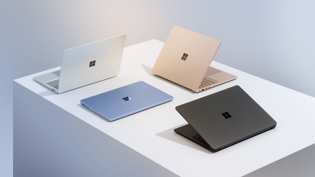 Surface Laptop 7ᵗʰ Edition in four colors on a white pedestal