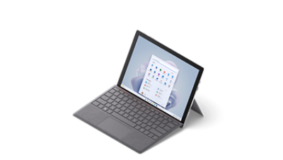 Surface Pro 7 Plus shown from 3/4 view with a Surface type cover in Platinum.