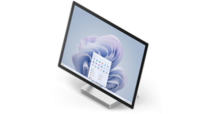 Surface Studio 2+ is shown from 3/4 view in desktop mode with the Windows 11 start screen.