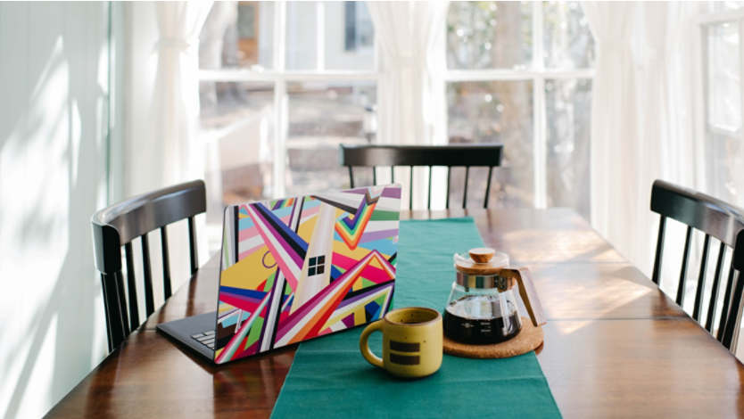 Surface laptop sitting on a kitchen table at home