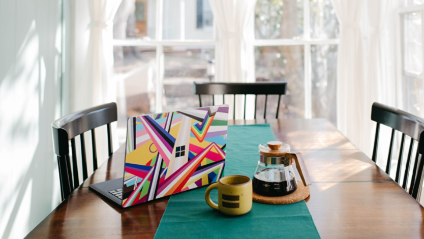 Surface laptop sitting on a kitchen table at home