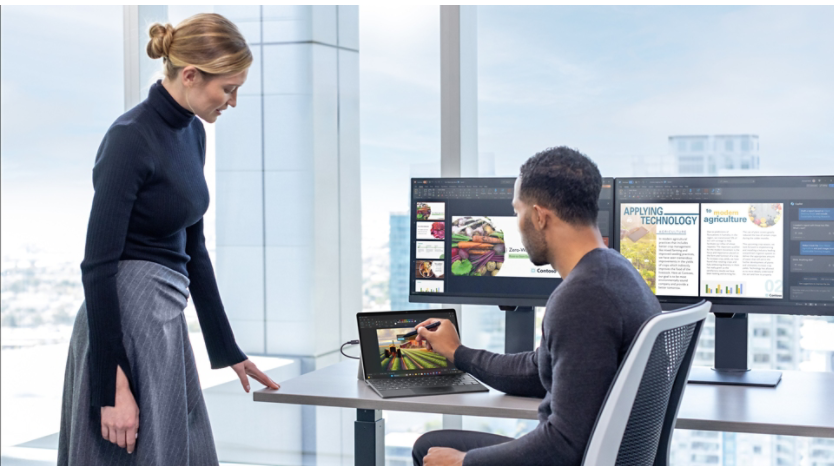 Man and woman working together at a desk