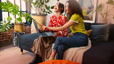 Two adults exploring features on a Copilot+ PC