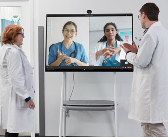 Two medical professionals partake in a Teams video call in a hospital setting